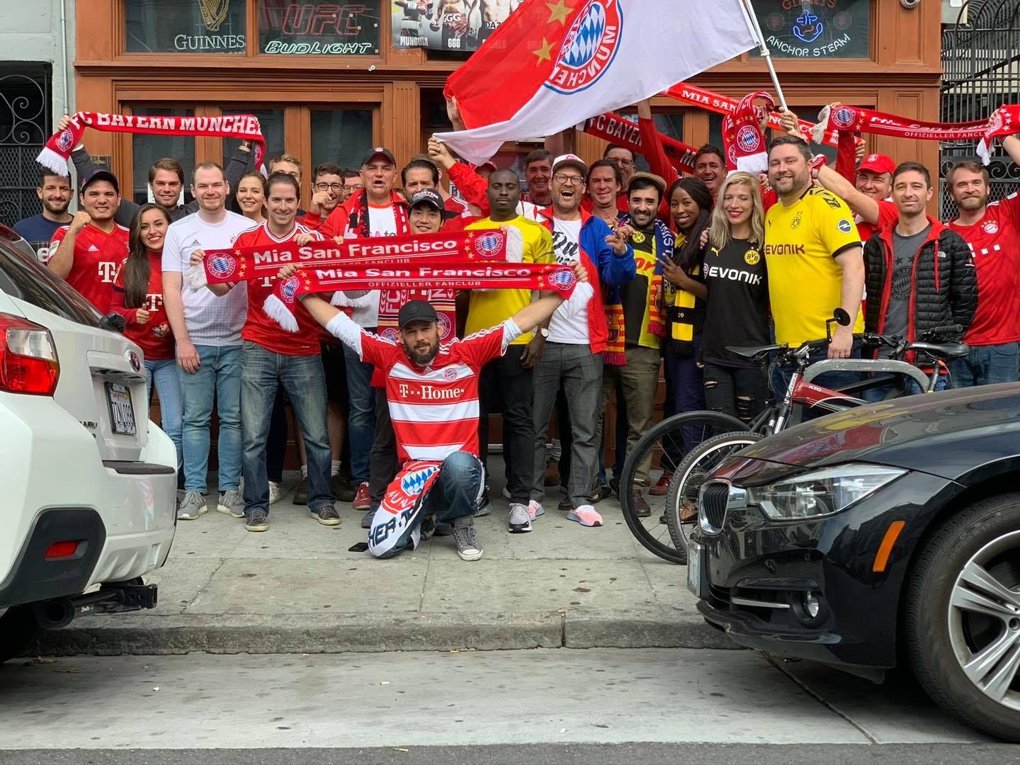 FC Bayern supporters group in San Francisco with scarves and flags at Bundesliga watch party