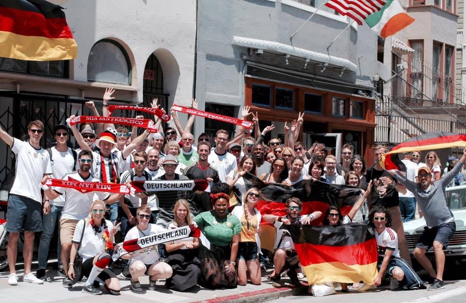 Mia San Francisco members wearing Deutschland and Bayern gear at outdoor community event